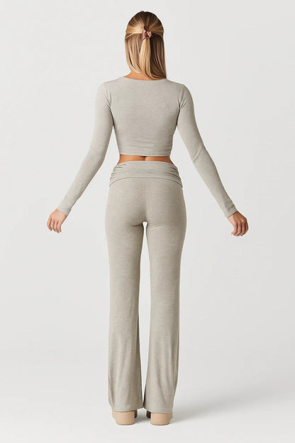 Ulpia – Completo Aderente Con Top A Maniche Lunghe E Pantaloni Svasati